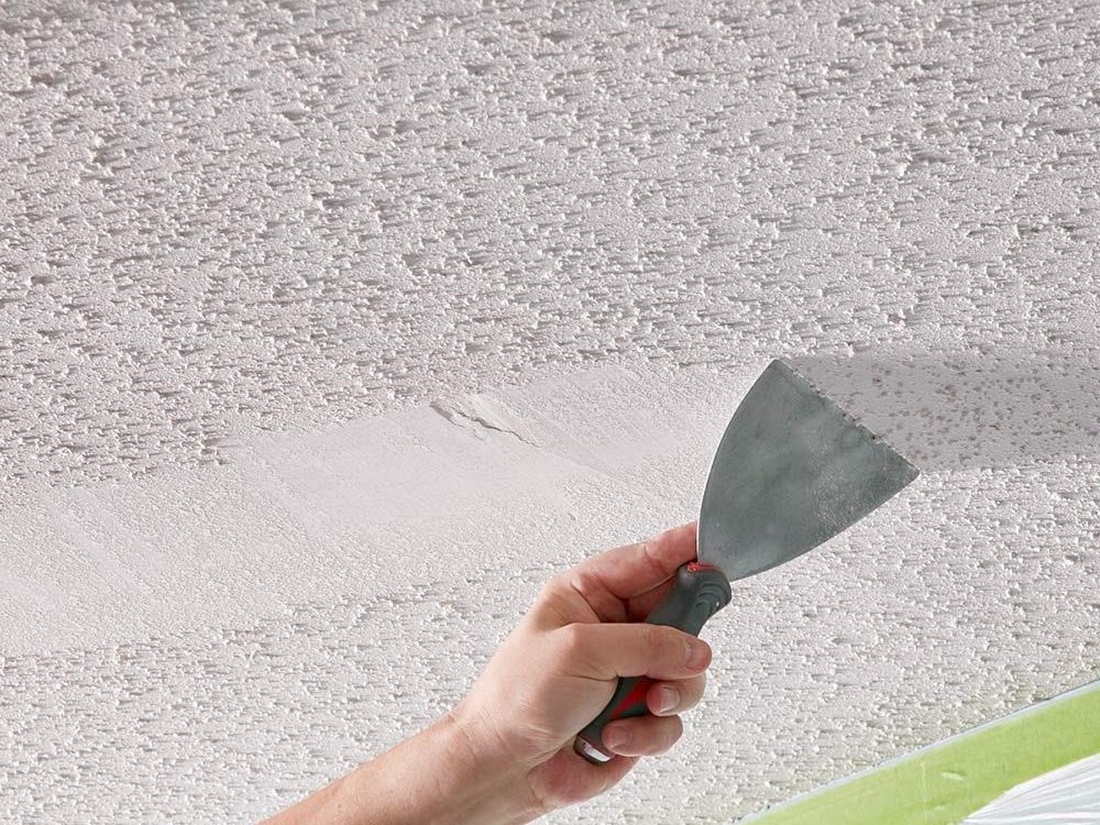 Scraping popcorn texture off a ceiling with a putty knife